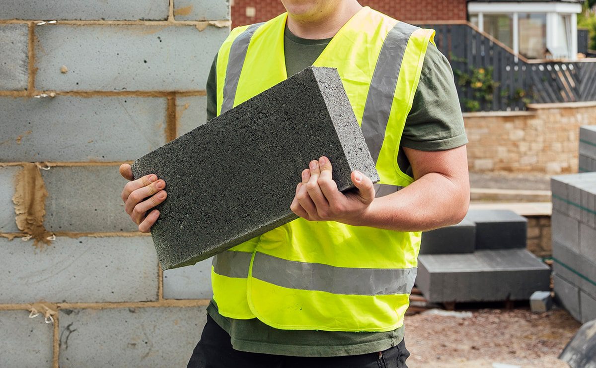 dense concrete blocks being carried